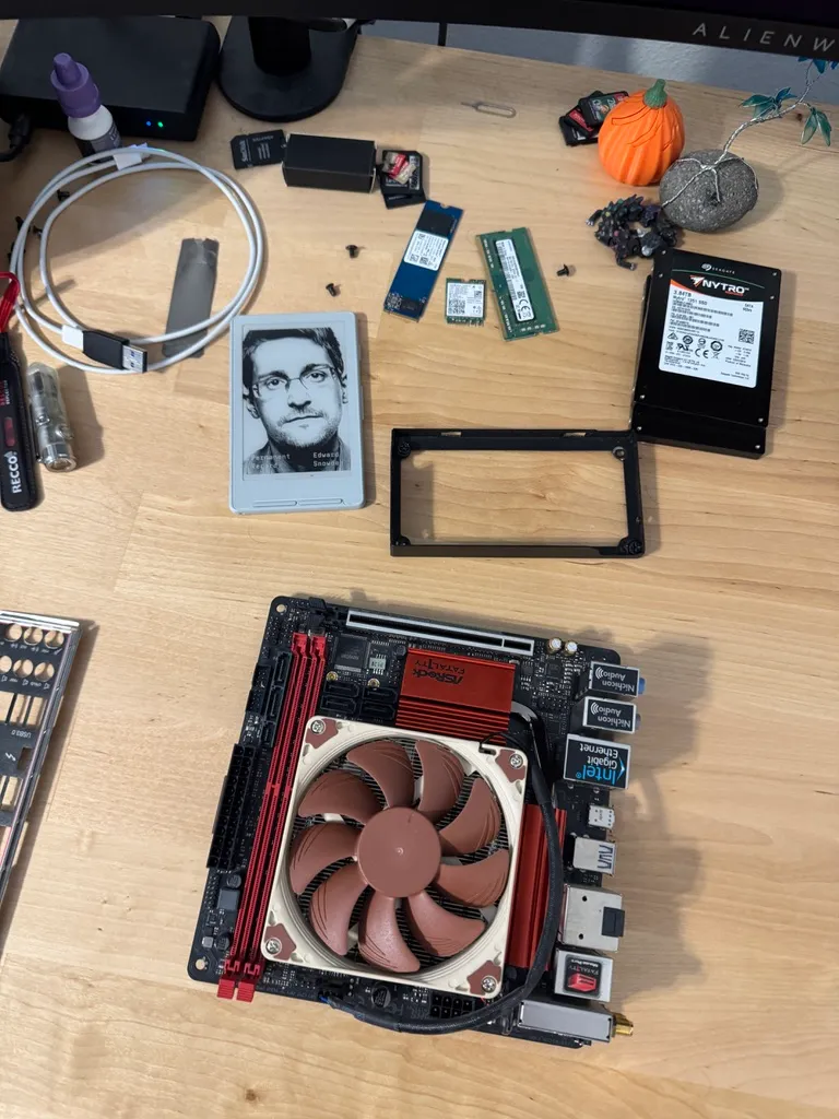 A mini-ITX board and NAS parts spread across a desk during the build